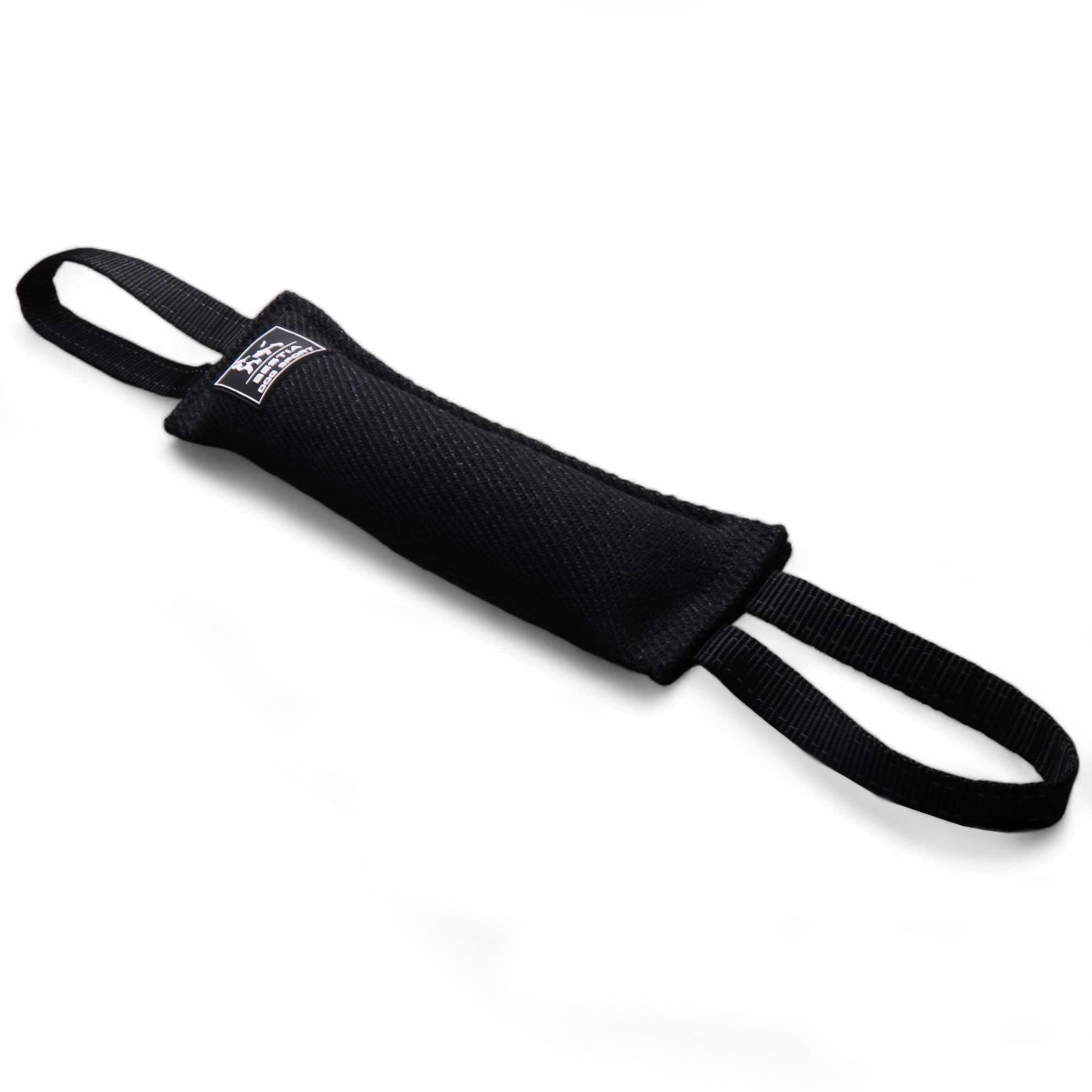 A black Bestia Dog Sport Bite Tug made of heavy-duty fabric, featuring two nylon loop handles for a secure grip during professional K9 protection or agility training.