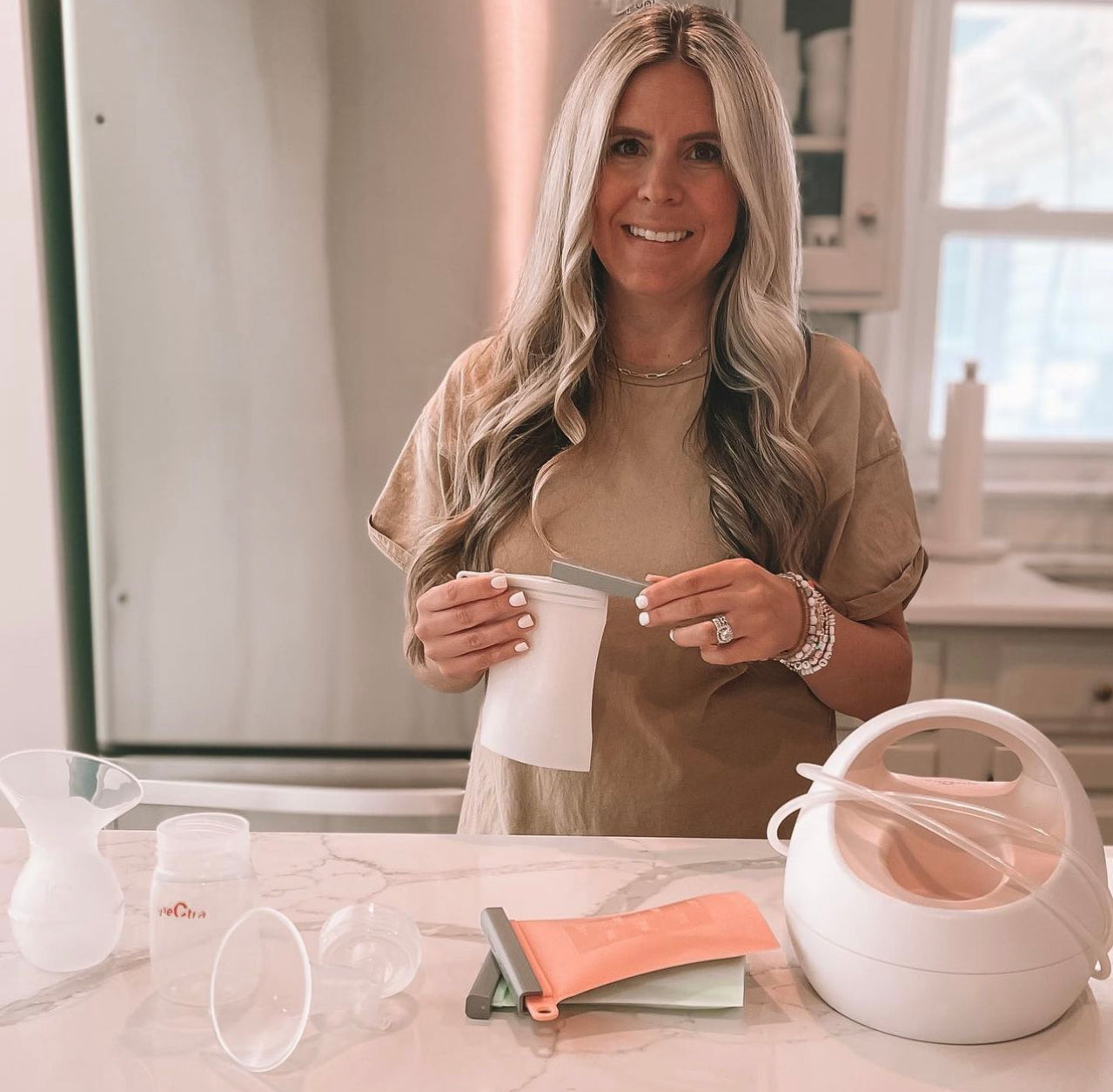 Woman in a kitchen with Junobie.