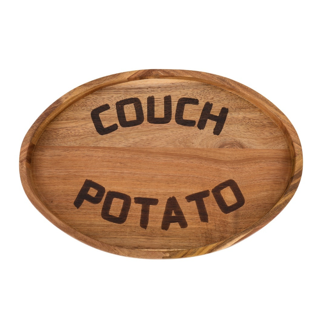 Close-up of natural acacia wood grain and engraved Couch Potato lettering on the tray surface