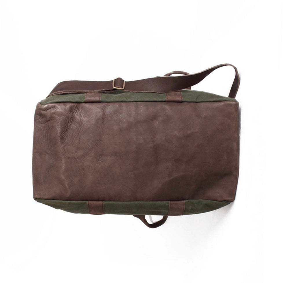 Underside of duffel bag on a white background