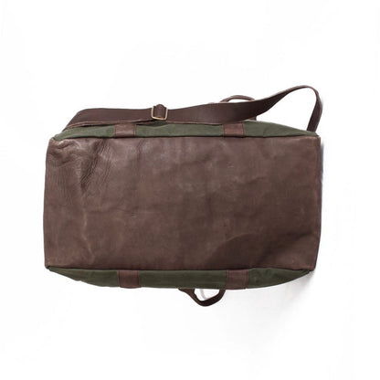 Underside of duffel bag on a white background
