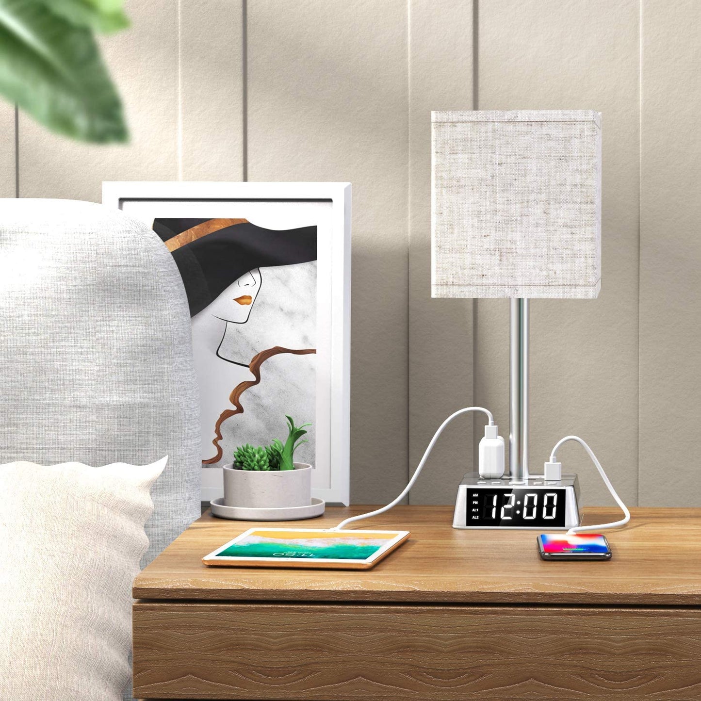 Modern bedside lamp with linen shade and built-in alarm clock base, featuring USB charging ports on a clean wooden nightstand.