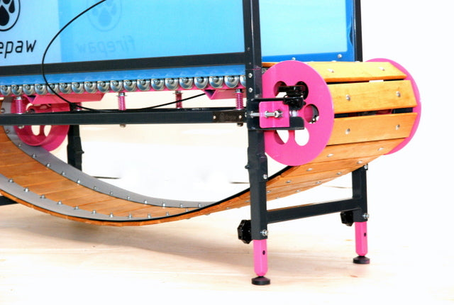 A close-up of a FirePaw professional dog treadmill featuring natural wooden slats, pink shock-absorbing wheels, and a precision mechanical track system for smooth canine running.
