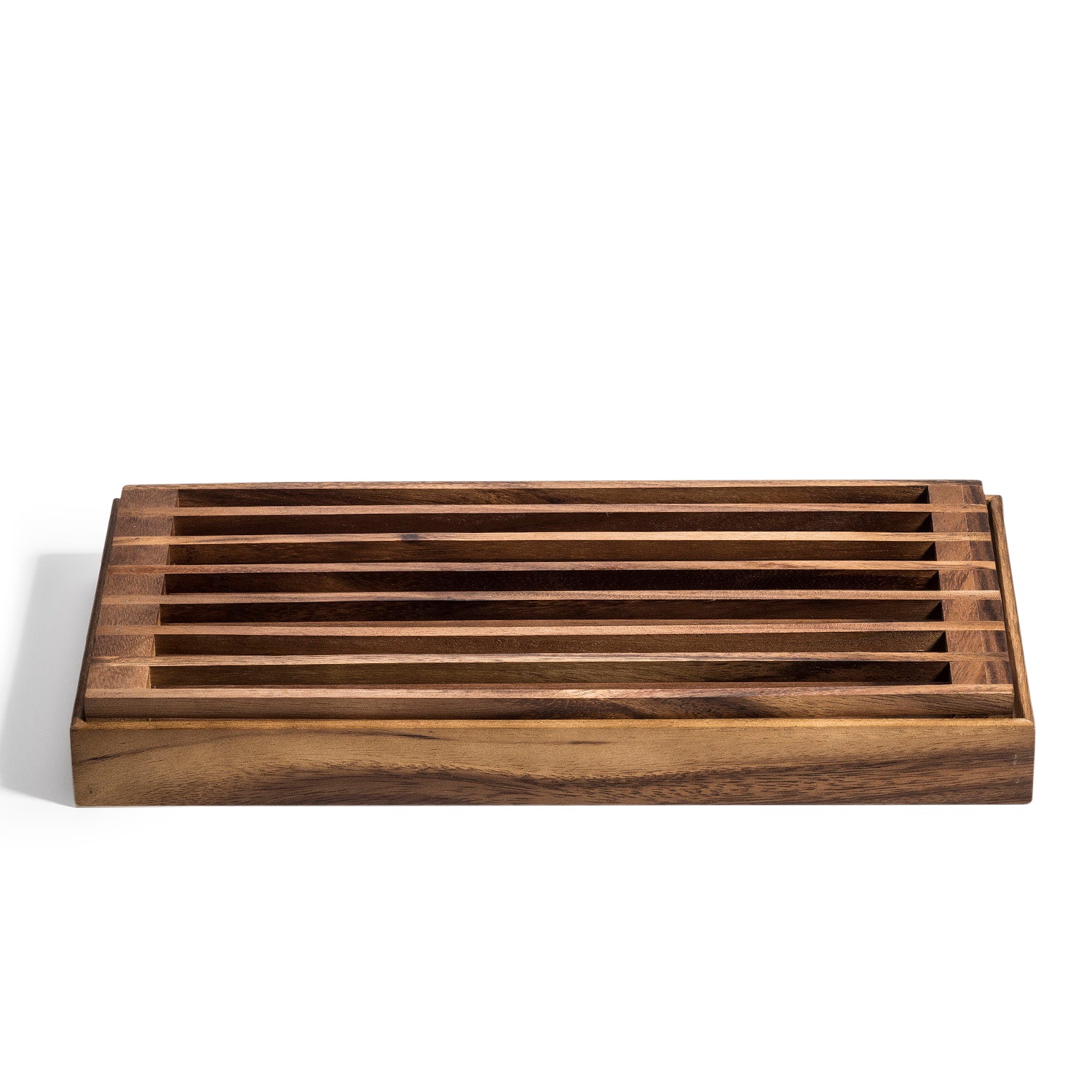 Acacia wood bread crumb catcher with removable slatted top on a white background.