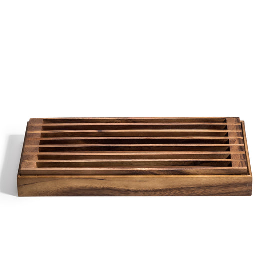 Acacia wood bread crumb catcher with removable slatted top on a white background.