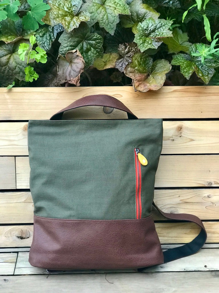 Close-up of Canopy Verde backpack strap and vegan leather details, lightweight everyday commuter bag